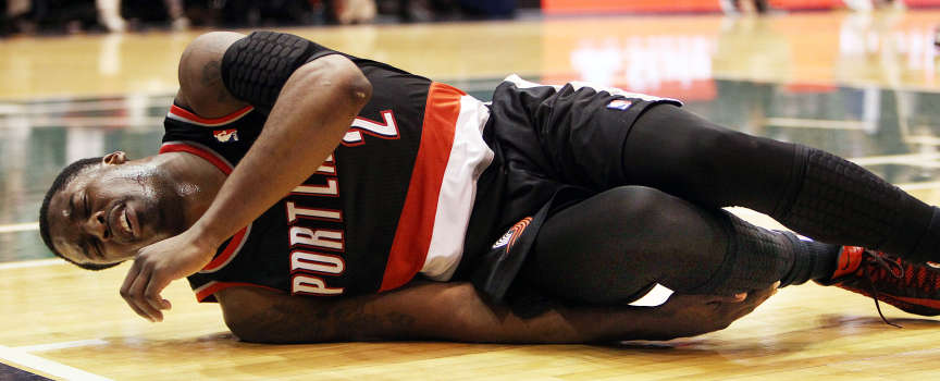 Wesley Matthews of the Portland Trail Blazers goes down after turning an ankle during NBA basketball against the Utah Jazz in Salt Lake City, Friday, Feb. 1, 2013. (Submission date: 02/01/2013)