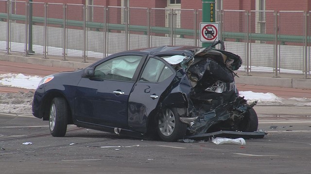 Woman in critical condition after truck slams into car at light