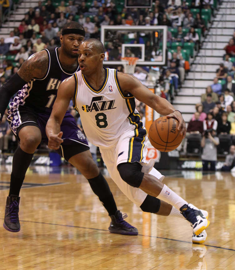 Utah Jazz point guard Randy Foye (8) drives past Sacramento Kings center DeMarcus Cousins (15) as the Utah Jazz and the Sacramento Kings play NBA basketball Monday, Feb. 4, 2013, in Salt Lake City. (Tom Smart, Deseret News)