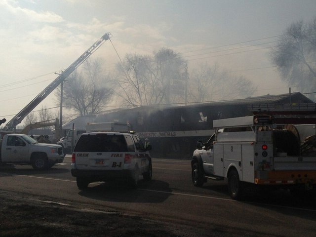Fire destroys warehouse, homes; may take days to extinguish