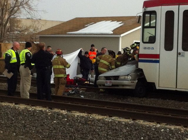 Man dies following TRAX, car crash