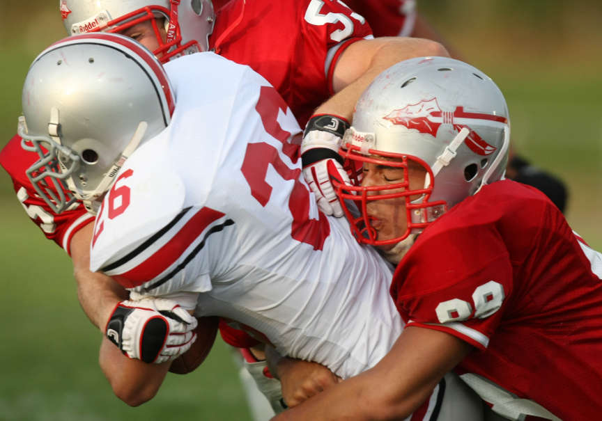 Bountiful's Helam Heimuli (cq) (right) brings down Spanish Fork running back Dallas Smith from behind during the Braves' home game vs. Spanish Fork in Bountiful, Utah August 28, 2009. He returns from his LDS mission to play for Weber State.