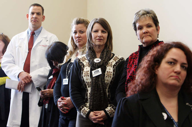 Those attending listen during a press conference in Salt Lake City, Tuesday, Feb. 5, 2013 concerning HB13. The bill would make smoking in vehicles, when children 15 and under are passengers, a secondary offense and carries a fine of up to $45. Most in this group described themselves as advocates for children.