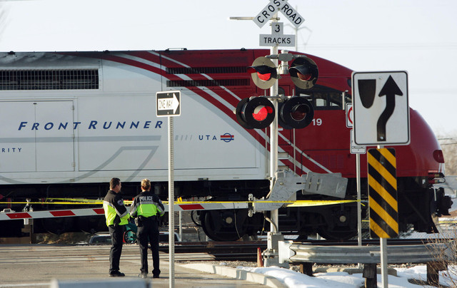 Provo police and UTA investigate the scene where a bicyclist was hit by a UTA FrontRunner train in Provo, Friday, Feb. 15, 2013. The bicyclist, a 69-year-old Provo man, was pronounced dead at a hospital. (Photo: Jeffrey D. Allred, Deseret News)