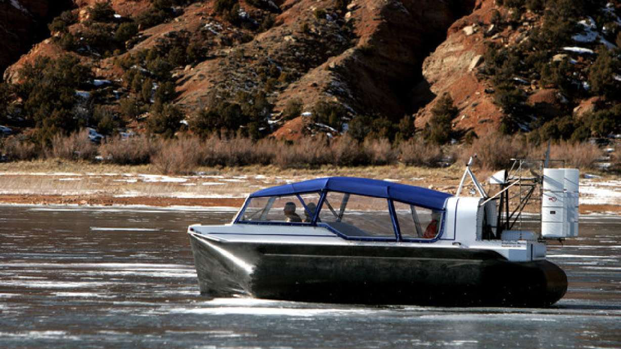 A Daggett County sheriff's pilots the agency's hovercraft on Flaming Gorge Reservoir. A woman is dead and search efforts continue for her adult daughter after she failed to resurface while recreating at Swim Beach on Flaming Gorge Reservoir on Saturday.