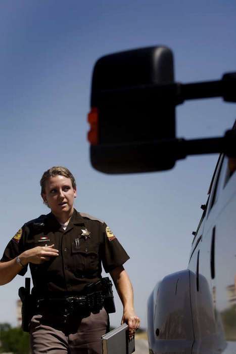Utah Highway Patrol Trooper Amy Fallows approaches a vehicle that she pulled over on I-215. (Laura Seitz?Deseret News)