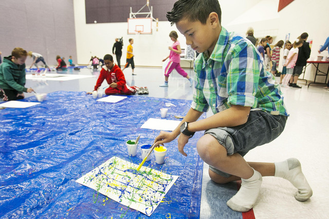 Kids let loose to create 'splash art' at school