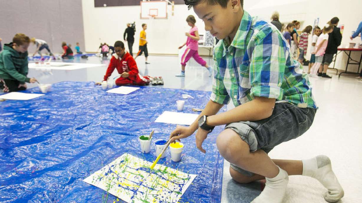 Kids let loose to create 'splash art' at school