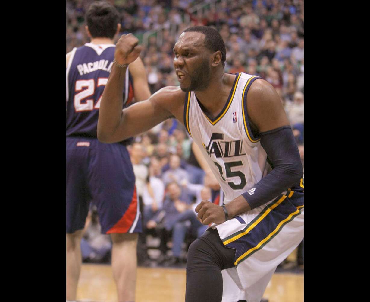 Utah's Al Jefferson pumps his fist after a made basket as the Jazz and the Hawks play Wednesday, Feb. 27, 2013 in Energy Solutions arena. Jefferson has missed the three previous games, all Jazz losses. (Scott G Winterton/Deseret News)