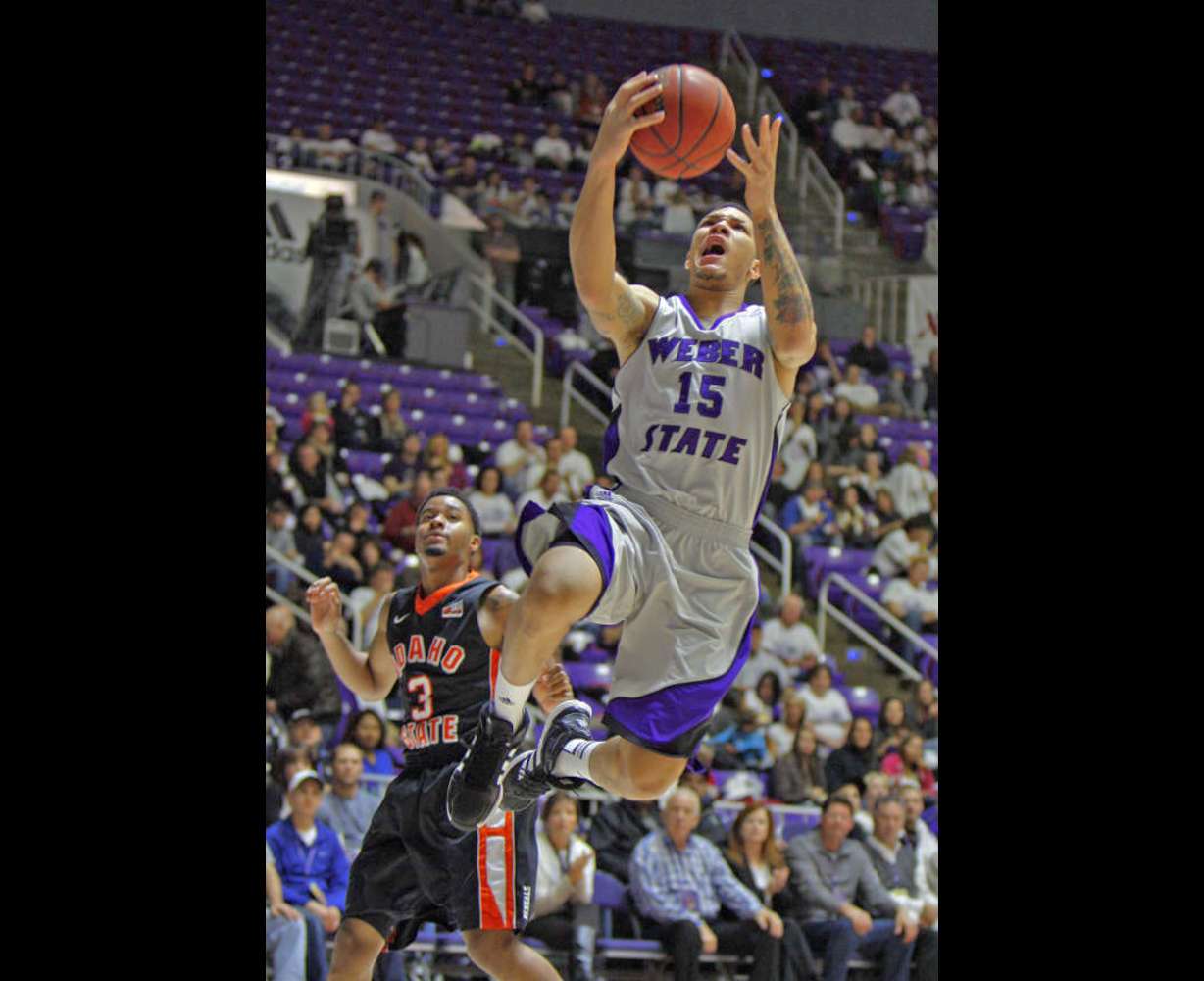 Weber State wing Davion Berry drives to the hoop against Idaho State. Berry was named a member of the first All-Conference team.