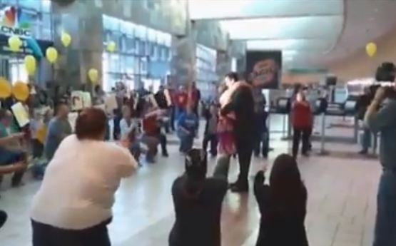 Returning missionary proposed to with airport flash mob