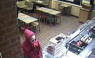 Photos released of alleged female restaurant robber
