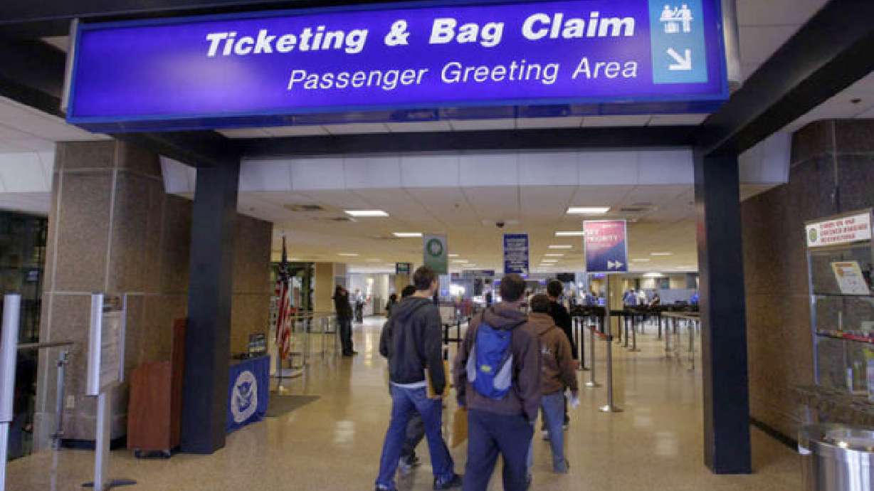 2 charged with stealing over $7K in property at S.L. airport