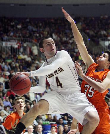 Lone Peak\'s Nick Emery drives on Brighton\'s Travis Devashrayee during the 5A state semifinals in Ogden Friday, March 1, 2013. (Jeffrey D. Allred, Deseret News)