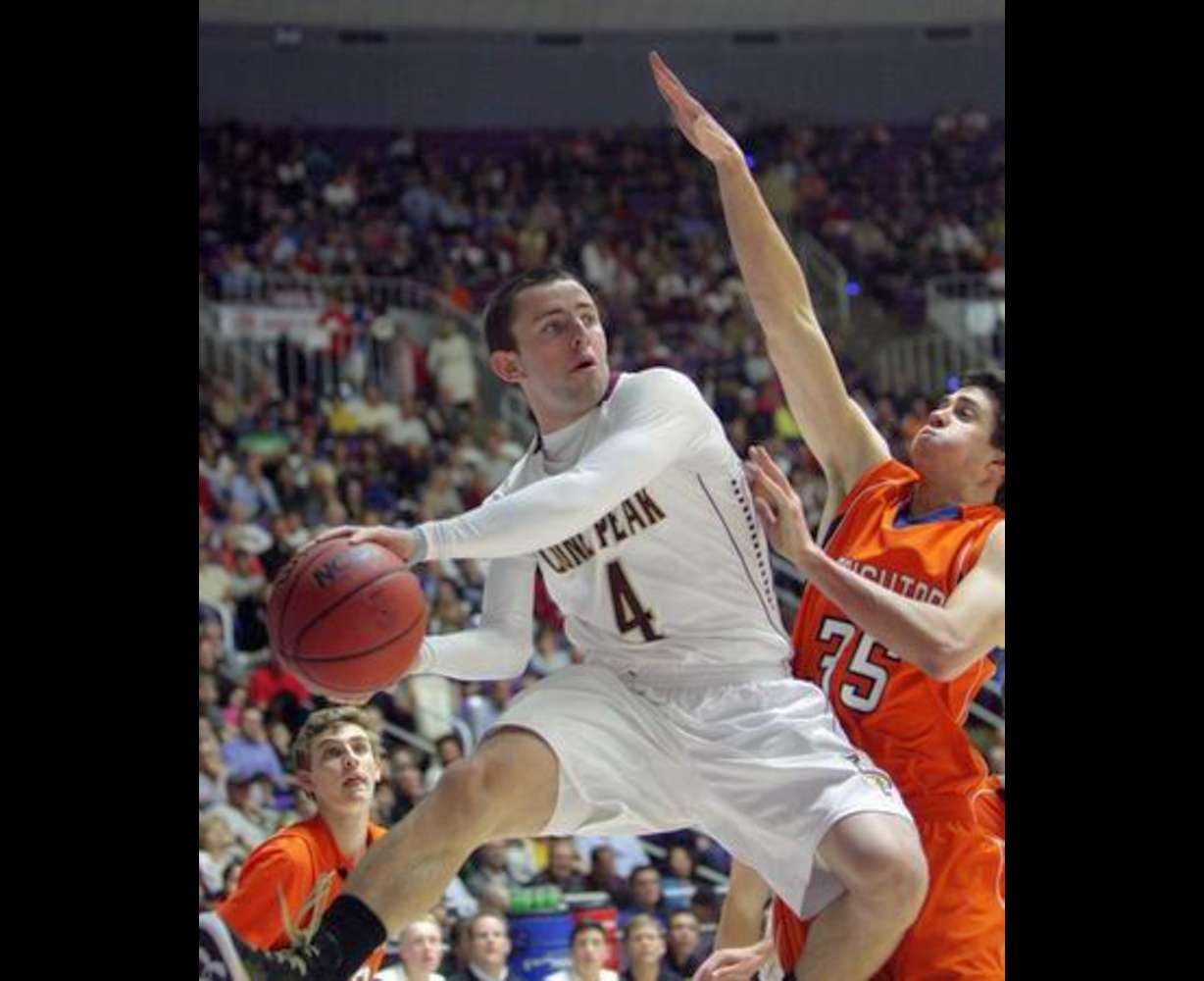 Lone Peak\'s Nick Emery drives on Brighton\'s Travis Devashrayee during the 5A state semifinals in Ogden Friday, March 1, 2013. (Jeffrey D. Allred, Deseret News)