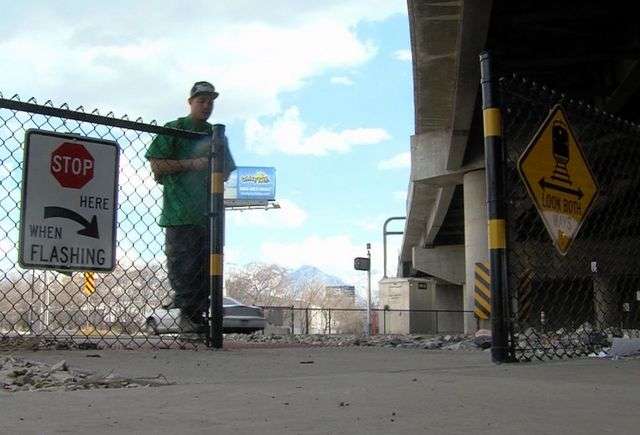 The new crossing is designed to grab a pedestrian's attention. As they approach the crossing, he or she will run into a fence. The pedestrian is then forced to change his or her line of travel, look up, and step to the right to proceed to the crossing.