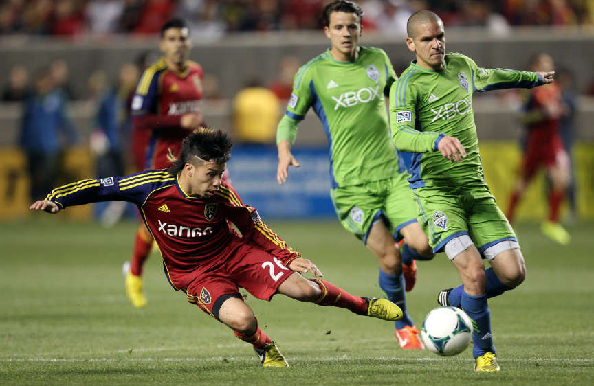 Real Salt Lake midfielder Sebastian Velasquez (26) competes with Seattle Sounders FC midfielder Osvaldo Alonso (6) during MLS action in Sandy Saturday, March 30, 2013. (Jeffrey D. Allred, Deseret News)