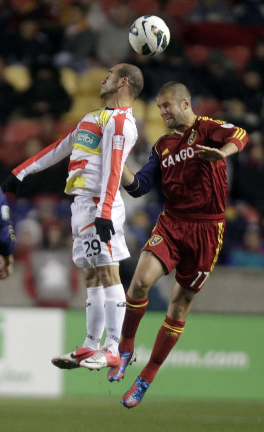 Esteban Ramirez of C.S. Herediano and Chris Wingert of Real Salt Lake jump for a header during their CONCACAF match up at Rio Tinto Stadium. Wingert returned from a foot injury in a scrimmage against the BYU men's soccer team. (Brian Nicholson/Deseret News)