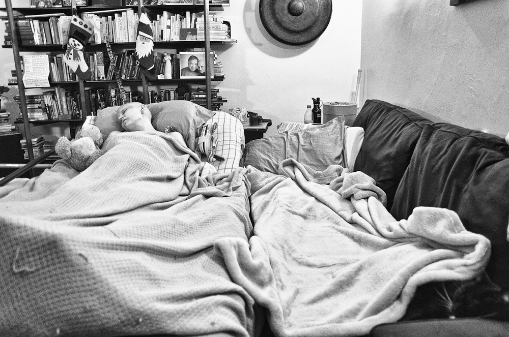 Jen resting in bed at home.