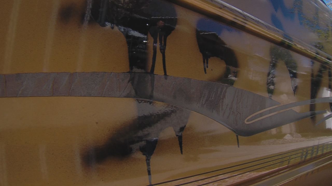 Vehicles spray painted with obscene messages in Sandy