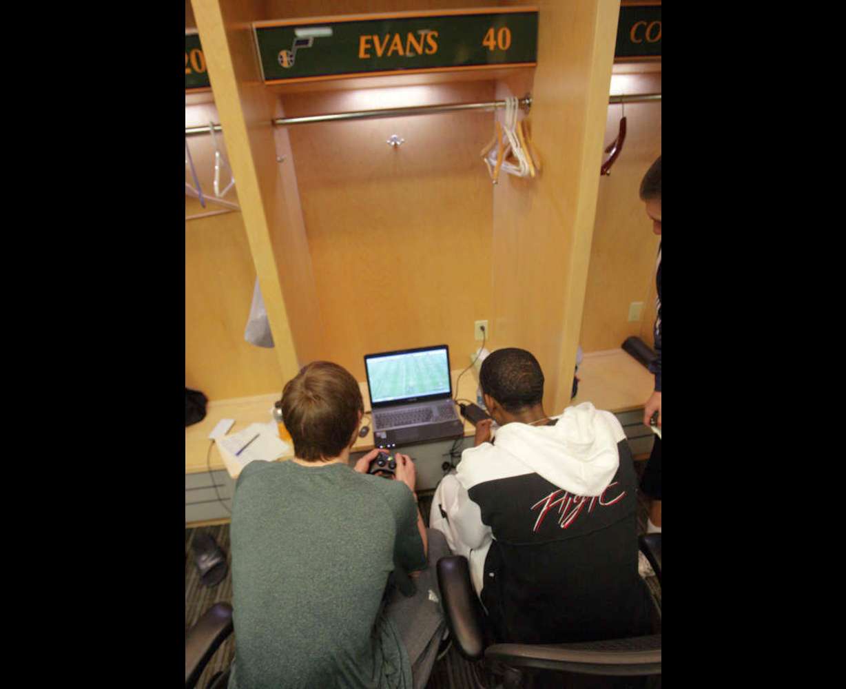 Utah Jazz shooting guard Gordon Hayward (20) and Utah Jazz small forward Jeremy Evans (40) plays a video game as the Jazz players clean out their lockers for the season in Salt Lake City Thursday, April 18, 2013. (Submission date: 04/18/2013)