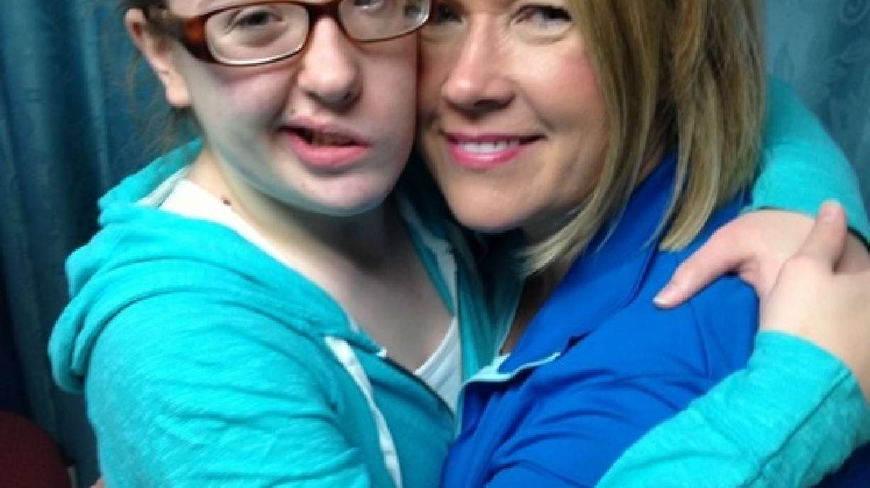 After brain tumor paralyzes her left side, girl gets smile back