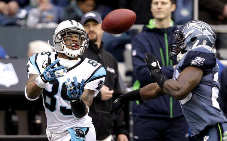Carolina Panthers' Steve Smith, left, grabs a 39-yard pass reception against Seattle Dec. 5, 2010 (AP Photo/Elaine Thompson)