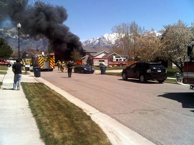 Fire destroys car, damages Sandy home
