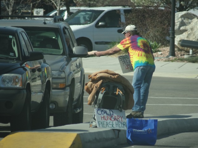 A panhandler asks for help at 900 West and State Street last week in American Fork. The city's mayor prepared a guide to let residents know what the laws are in regards to panhandlers. He also listed several resources for those in need of food, shelter and other basic needs. (Photo: Sam Penrod, KSL News)