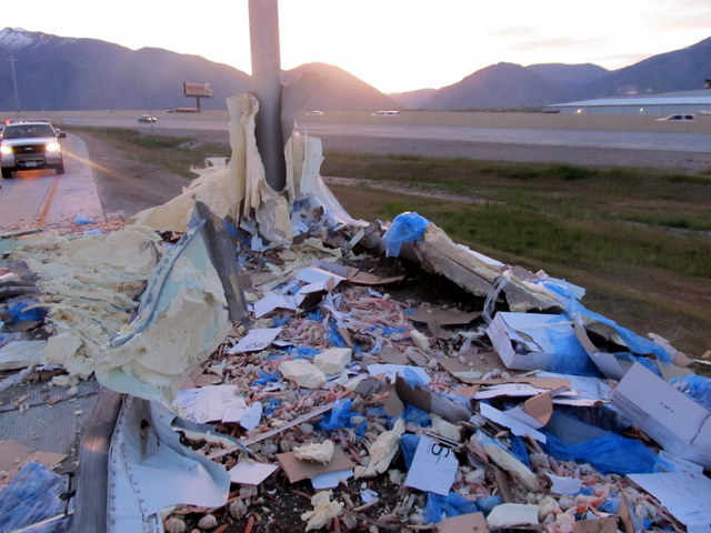 Semitrailer rolls, spills 75K lbs of crab