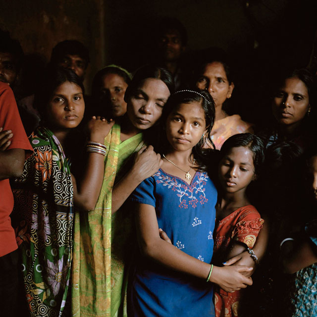The 500 survivors of the attack have been living as refugees in a collection of abandoned buildings in India. 
(Photo: courtesy Lynn Johnson, National Geographic)