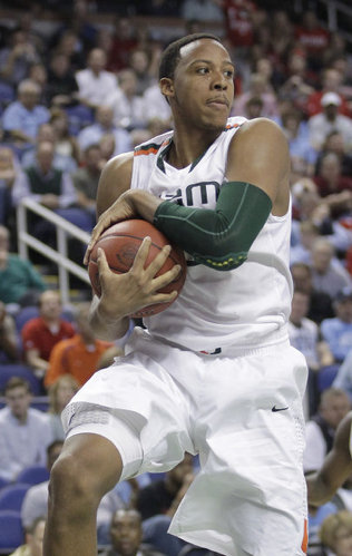 Miami's Kenny Kadji grabs a rebound against North Carolina State during the second half of an NCAA college basketball game in the semifinals of the Atlantic Coast Conference tournament in Greensboro, N.C., Saturday, March 16, 2013. (AP Photo/Bob Leverone) BOB LEVERONE /AP