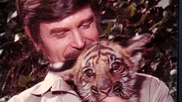 Goddard holds a tiger cub. (Family photo)