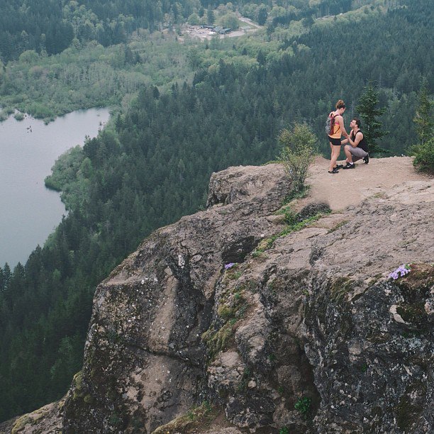 Photographer captures proposal on mountain, unites couple with images