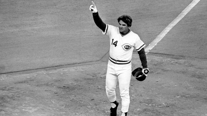 FILE - In this Sept. 11, 1985, file photo, Cincinnati Reds' Pete Rose gestures at first base after breaking Ty Cobb's record of 4,192 career hits with a single in the first inning of a baseball game against the San Diego Padres in Cincinnati. Baseball's all-time hits leader got his start on climbing up the list 50 years ago this week, when he made his big-league debut for the Reds in Cincinnati on April 8, 1963. (AP Photo/Al Behrman, File)