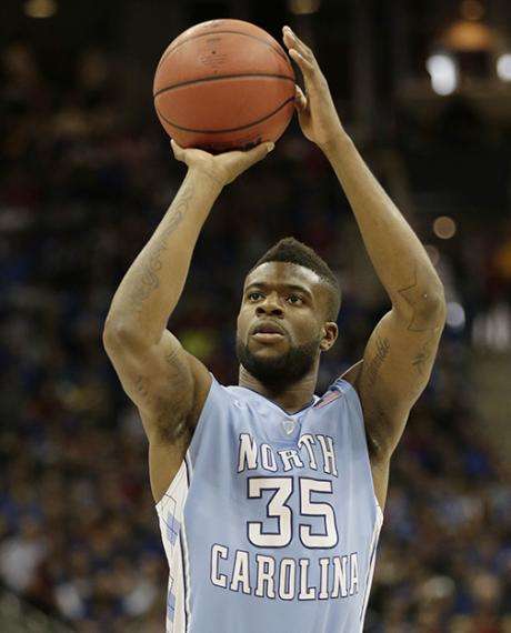 File photo of North Carolina guard/forward Reggie Bullock (35) shooting during the first half of a third-round game against Kansas in the NCAA college basketball tournament, March 24, 2013, in Kansas City, Mo. (AP Photo/Charlie Riedel)