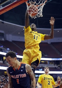 Long Beach State's James Ennis (11) dunks over Cal State Fullerton guard Jared Brandon (1) in the first half of an NCAA college basketball game in the Big West Conference men's tournament Thursday, March 14, 2013, in Anaheim, Calif. (AP Photo)