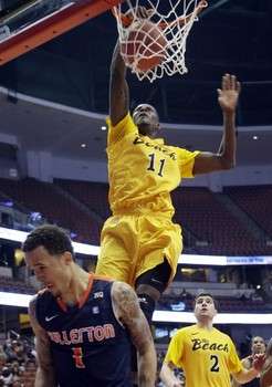 Long Beach State's James Ennis (11) dunks over Cal State Fullerton guard Jared Brandon (1) in the first half of an NCAA college basketball game in the Big West Conference men's tournament Thursday, March 14, 2013, in Anaheim, Calif. (AP Photo)