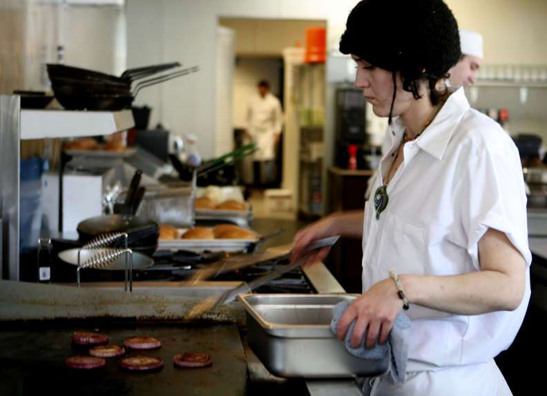 Heather Letz cooks red onions at the Copper Onion restaurant in Salt Lake. Wednesday, January 20, 2010. (Michael Brandy, Deseret News) (Submission date: 01/20/2010)