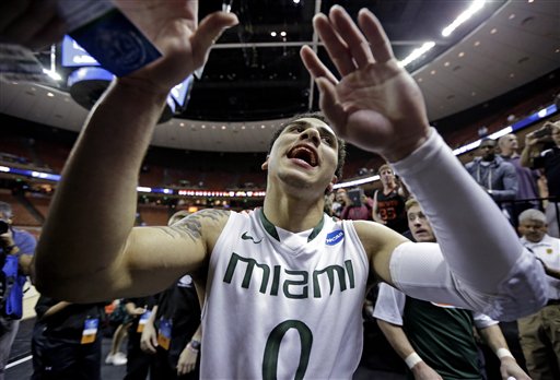 Miami's Shane Larkin celebrates after a third-round game of the NCAA college basketball tournament against the Illinois Sunday, March 24, 2013, in Austin, Texas. Miami won 63-59. (AP Photo/Eric Gay)
