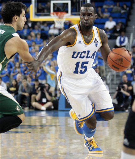 UCLA guard/forward Shabazz Muhammad (15) drives as Cal Poly's Chris O'Brien defends during the second half of an NCAA college basketball game in Los Angeles, Sunday, Nov. 25, 2012. Cal Poly won 70-68. (AP Photo/Jason Redmond)