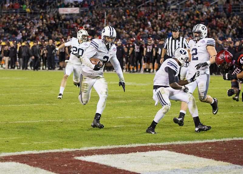 Kyle Van Noy scores a touchdown after intercepting San Diego State's Ryan Dingwell in the Poinsettia Bowl, Dec. 20, 2012.