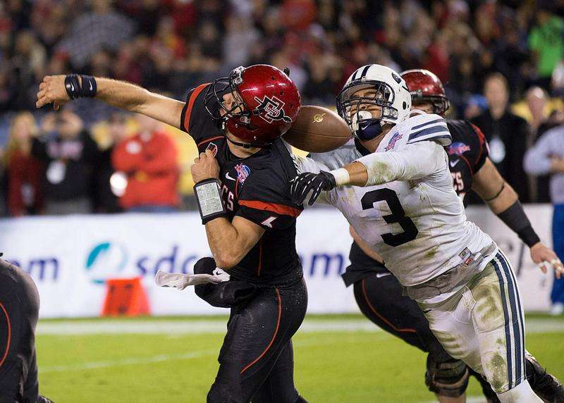 Kyle Van Noy forces a fumble resulting in a touchdown at the Poinsettia Bowl, Dec. 20, 2012.