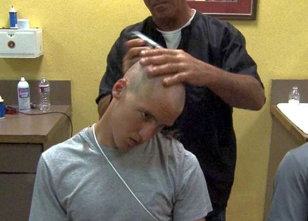 The beginning of boot camp includes a hair cut for Marine recruits.