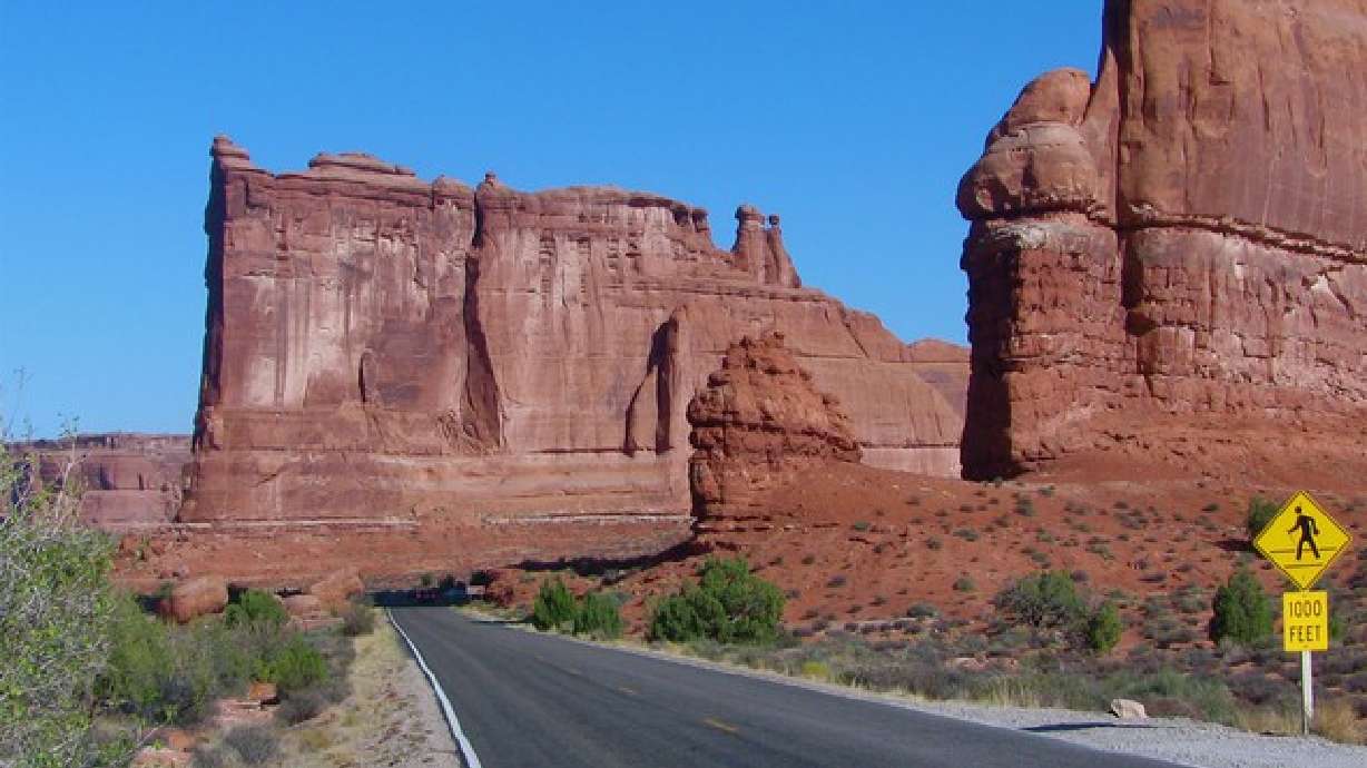In Arches National Park, the highway passes by Courthouse Towers. The Utah National Parks Challenge kicked off Wednesday, allowing participants to complete a 369-mile race at their own pace throughout the remainder of 2021.