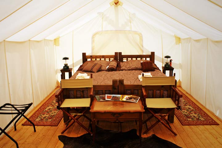Tent camping at its most luxurious. Sleep in a king-sized bed in your 
own room. (Photo: Moab Under Canvas)