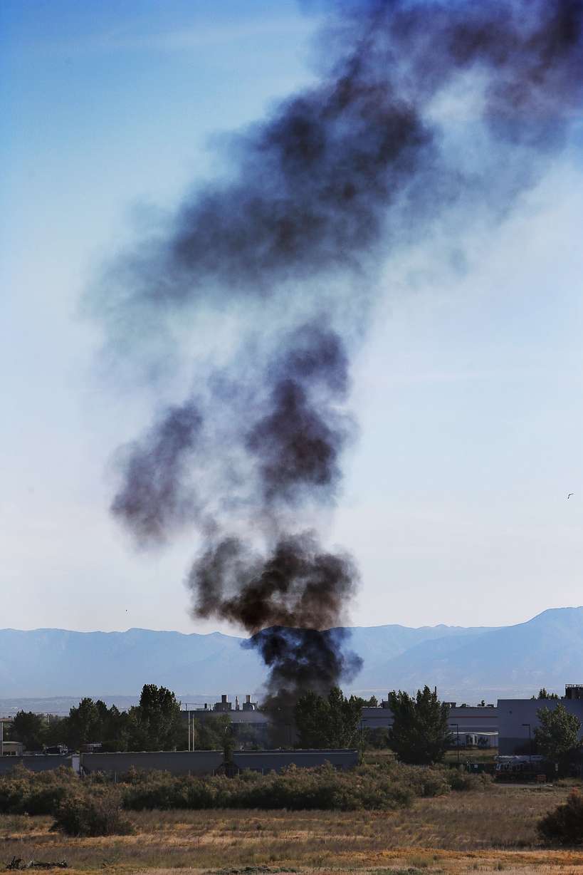 Black smoke rises as fire crews work to resolve a potentially explosive chemical situation in Salt Lake City on Monday, July 1, 2013. (Photo: Ravell Call, Deseret News)
