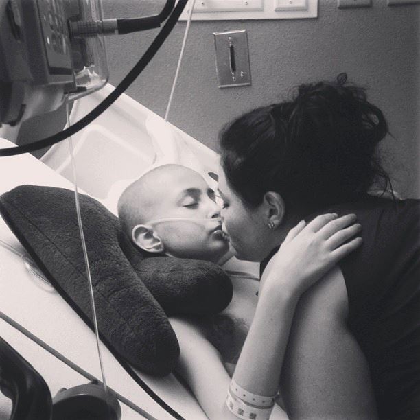 "Talia gets a kiss from her big sister Mattia. God bless these sweet
children and all they have been through together." (Photo: Angels for
Talia Facebook page)