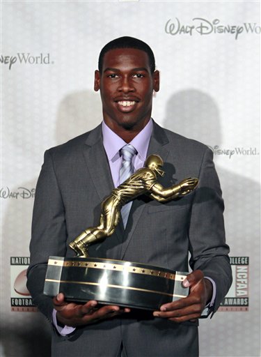 Southern California receiver Marqise Lee displays his trophy for the Biletnikoff Award after being named the nation's outstanding receiver at the Home Depot College Football Awards in Lake Buena Vista, Fla., Thursday, Dec. 6, 2012. (AP Photo/John Raoux)
