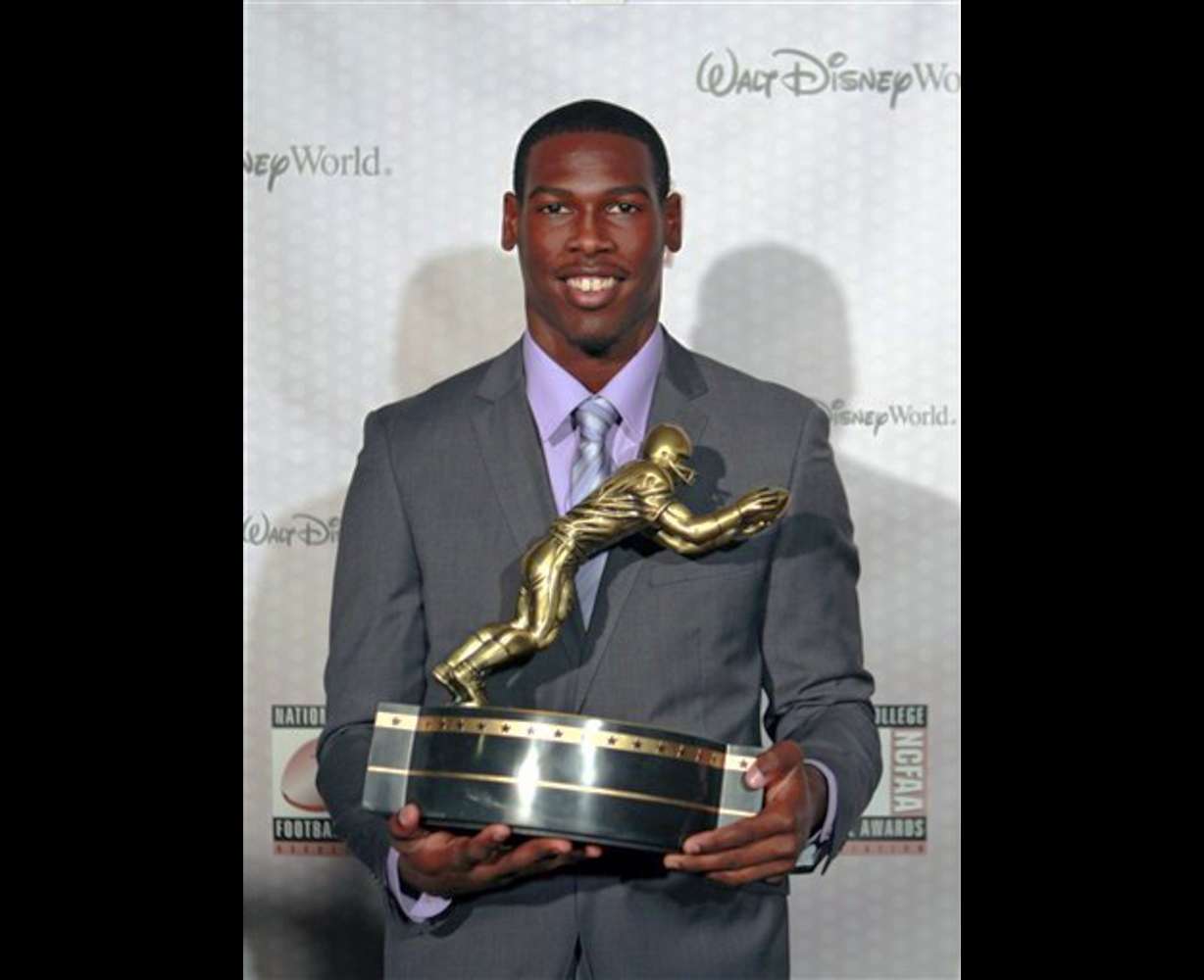 Southern California receiver Marqise Lee displays his trophy for the Biletnikoff Award after being named the nation's outstanding receiver at the Home Depot College Football Awards in Lake Buena Vista, Fla., Thursday, Dec. 6, 2012. (AP Photo/John Raoux)